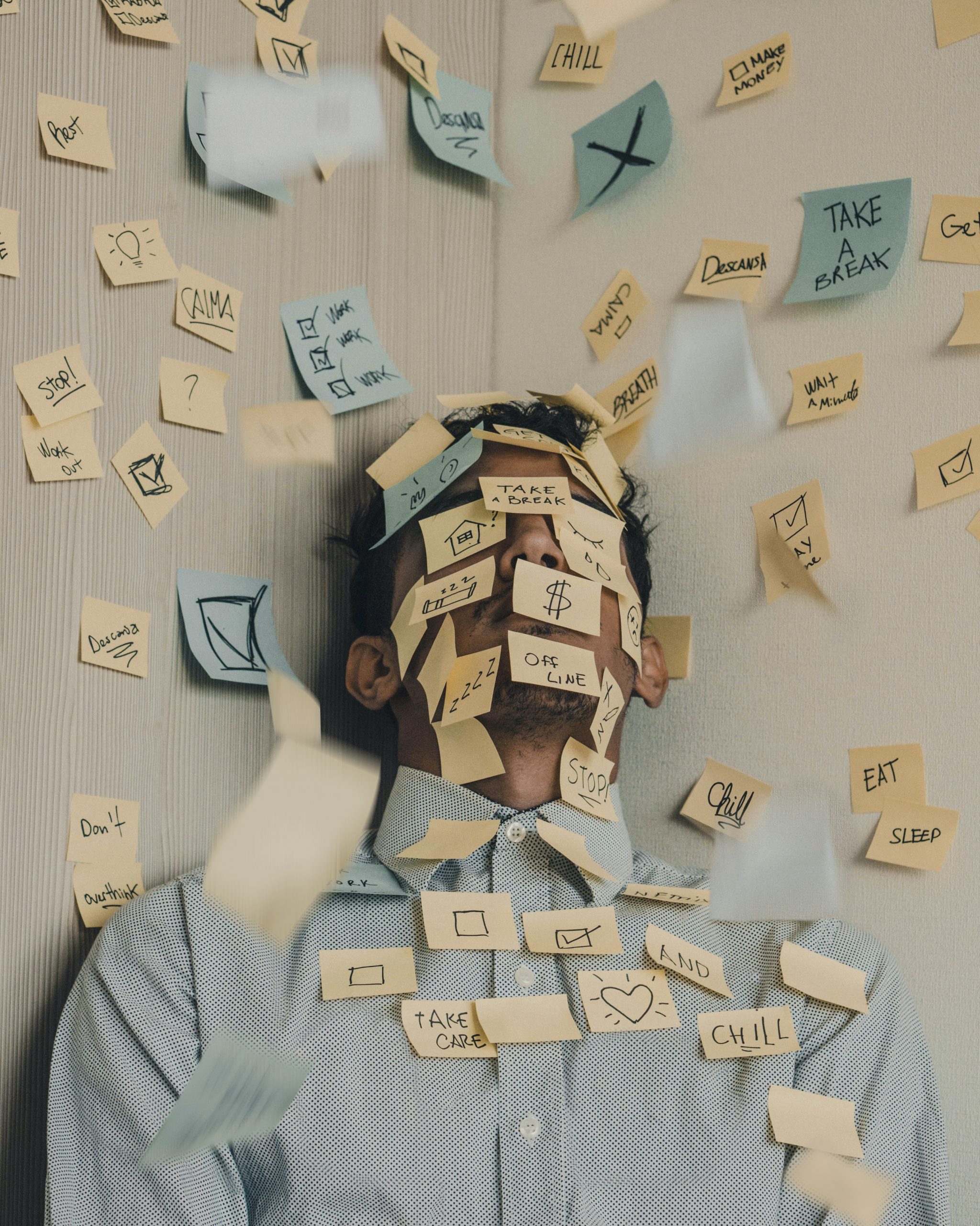 A man covered completely in "to do" post-it notes.